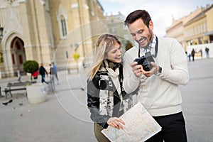 Tourist couple enjoying sightseeing and exploring city