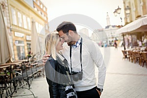 Tourist couple enjoying sightseeing and exploring city