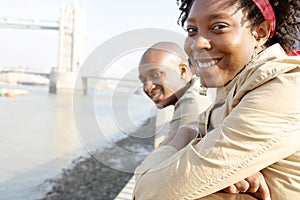 Tourist couple in London with map.