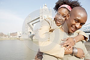 Tourist couple in London with map.