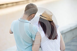 A tourist couple looking for direction at map