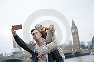 Tourist Couple taking selfie at Big Ben, London