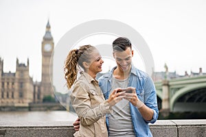 Tourist Couple taking selfie at Big Ben, London