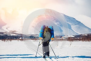 Tourist on cross-country skiing goes hiking
