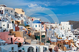 Tourist crowd in a viewpoint in Oia Village, Santorini island, Greece