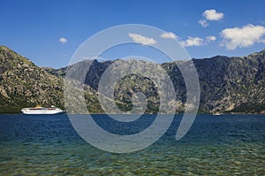 Tourist  cruise sea liner is sailing on the mountain background