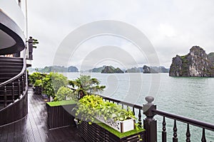 Tourist cruise ships sailing among limestone mountains in Halong Bay, Vietnam