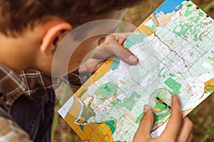 Tourist determine the route map and compass