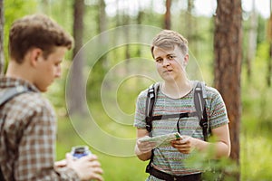 Tourist determine the route map and compass