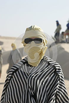 Tourist dressed like bedouin with sunglasses