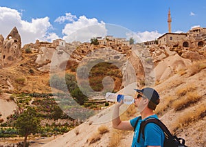 Tourist drinking water