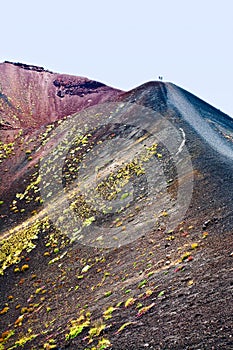 Tourist on edge crater, Etna
