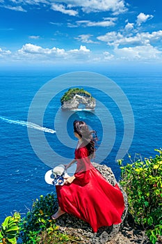 Tourist enjoying Banah cliff at nusa penida island, bali, Indonesia