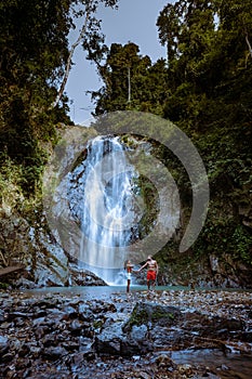 A tourist is enjoying the beauty of the waterfall in Chumphon province, Thailand , Klongphrao waterfall Thailand