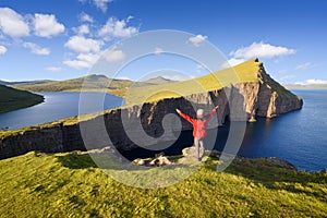 Tourist enjoys the view of Lake Sorvagsvatn on Vagar Island, Faroe Islands