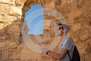 Young man exploring the ruins of masada in israel photo