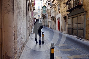 Tourist Exploring Streets of Valletta Malta