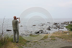 Tourist films at the Baltic Sea.Denmark