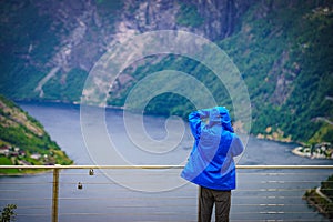 Tourist at fjord Geirangerfjord, Norway