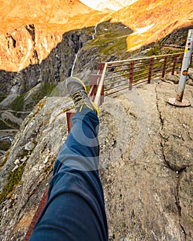 Tourist foot shoe on Trollstigen viewpoint in Norway