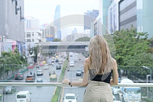 Tourist foreigner is sightseeing traffic and city view at Bangkok