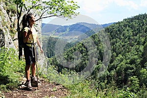 Tourist in front of forest hills in Slovak Paradise