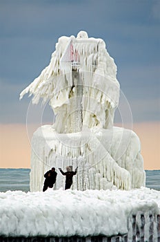 Tourist and frozen lighthouse