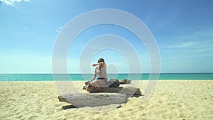 Tourist Girl With Backpack Drink Water On Beach