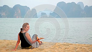 Tourist girl at beach,limestone view of halong bay,vietnam