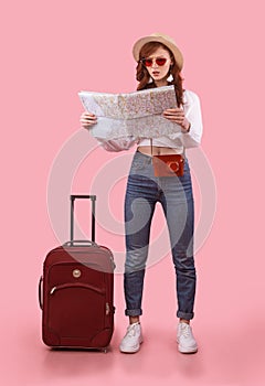 Tourist Girl Holding Map Standing With Suitcase On Pink Background