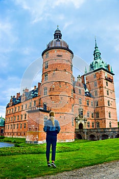 Tourist girl near Vallo Castle. In 18th century, the castle served as