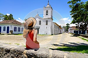 Tourist girl in Paraty historic cultural town in Rio de Janeiro State, Brazil