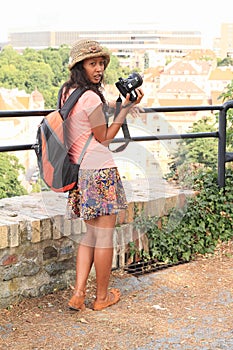 Tourist - Girl taking photo of city