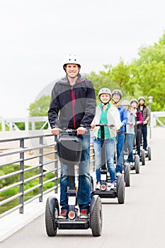 Tourist group driving Segway at sightseeing tour