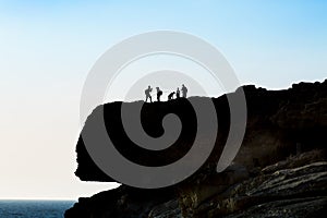 Tourist group on the top of the cliff.