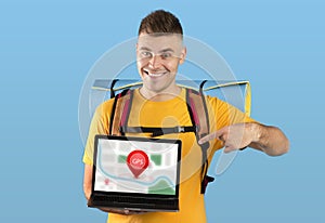 Tourist Guy Showing Laptop With Navigation Map On Blue Background