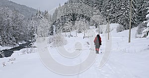 Tourist hike in a solo trip in winter mountains