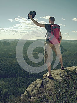Tourist with hiking backpacks in mountain hike in summer