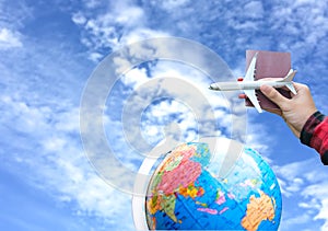 Tourist holding airplane flight travel and passport traveller fly travelling citizenship air on blue sky background