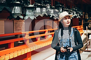 Tourist holding camera cheerful visit