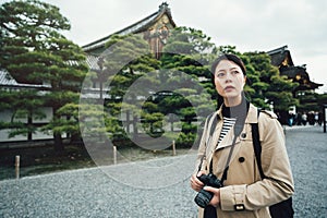 Tourist holding camera searching amazing views