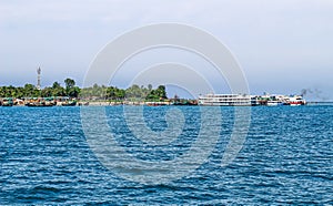 Tourist jetty of St. Martin`s Island, Bangladesh. Photo of a seaport on an island with many ships docked. Good to use for outdoor.