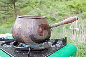 Tourist kettle on gas stove