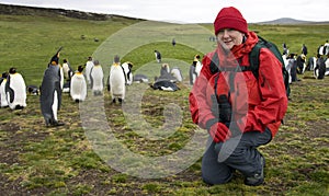 Tourist with King Penguins - Falkland Islands