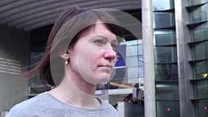 Tourist lady walks and looks at attractions near the European Parliament in Brussels. Belgium. slow motion.dolly zoom