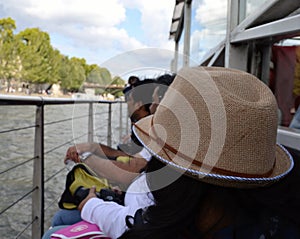 Tourist Lady wearing Women's Straw Fedora Hat, Cruise Tour on Siene River