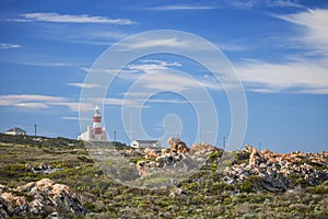 Tourist landmark lighthouse on a hill in the Southern most point of Africa, Cape Agulhas.