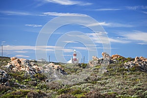 Tourist landmark lighthouse on a hill in the Southern most point of Africa, Cape Agulhas.