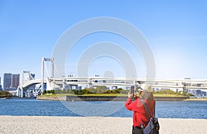 Tourist with landscape view at Daiba beach and Rainbow bridge at Tokyo Japan