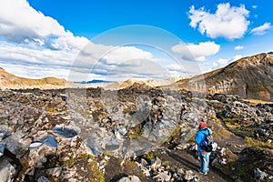 Tourist at Laugahraun lava field in Iceland